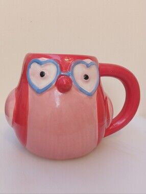 Adorable Spritz pink owl mug featuring heart-shaped glasses and a whimsical scul